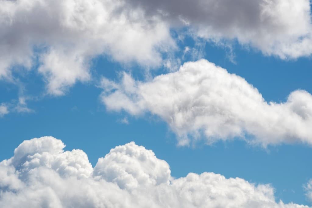 Blue sky with white cumulus clouds